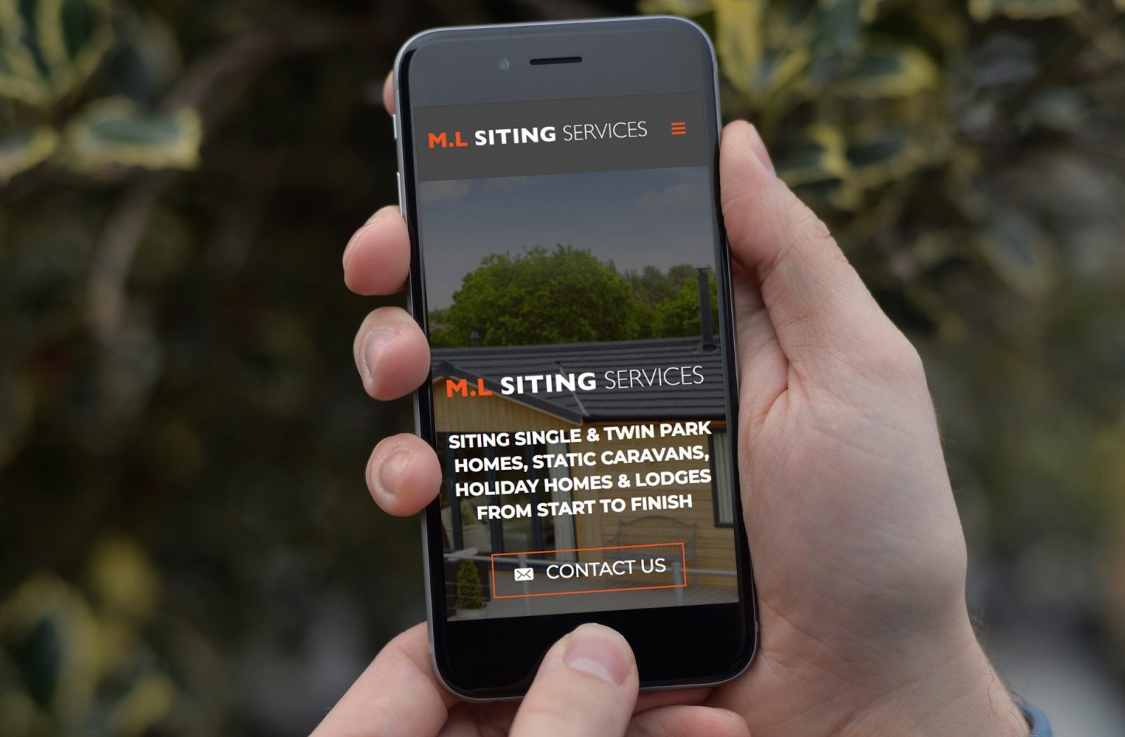 A phone showing the home page of the website design for M.L Siting Services