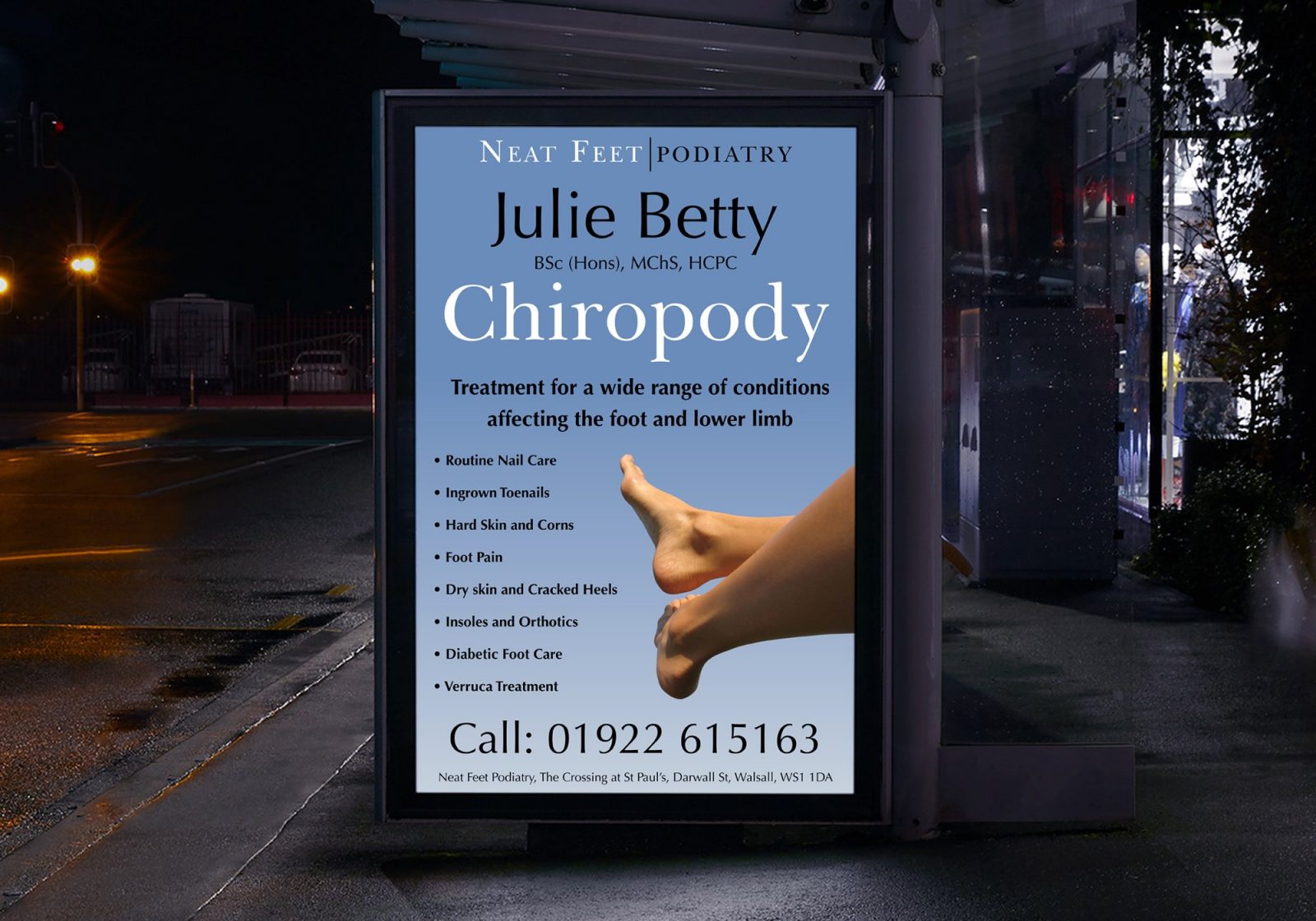 Poster in a bus stop shelter at night for Julie Betty Podiatry