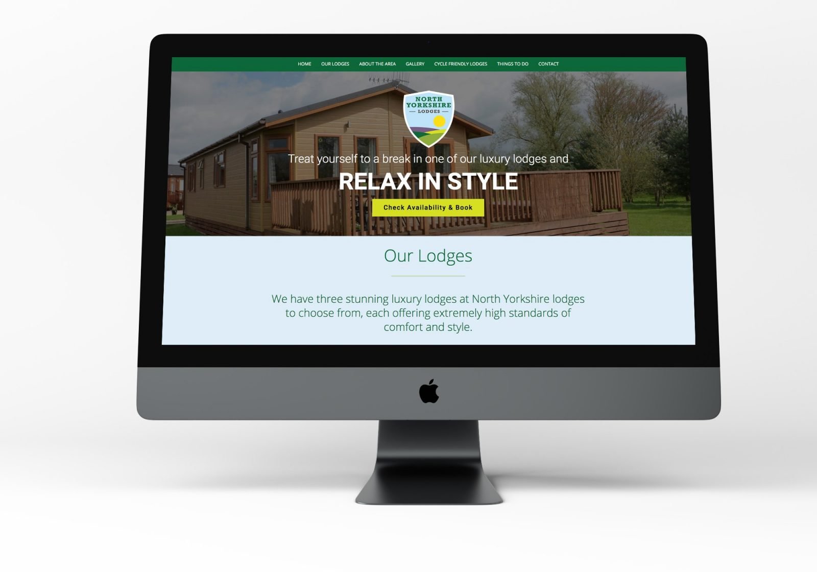 A computer showing the home page for North Yorkshire Lodges website