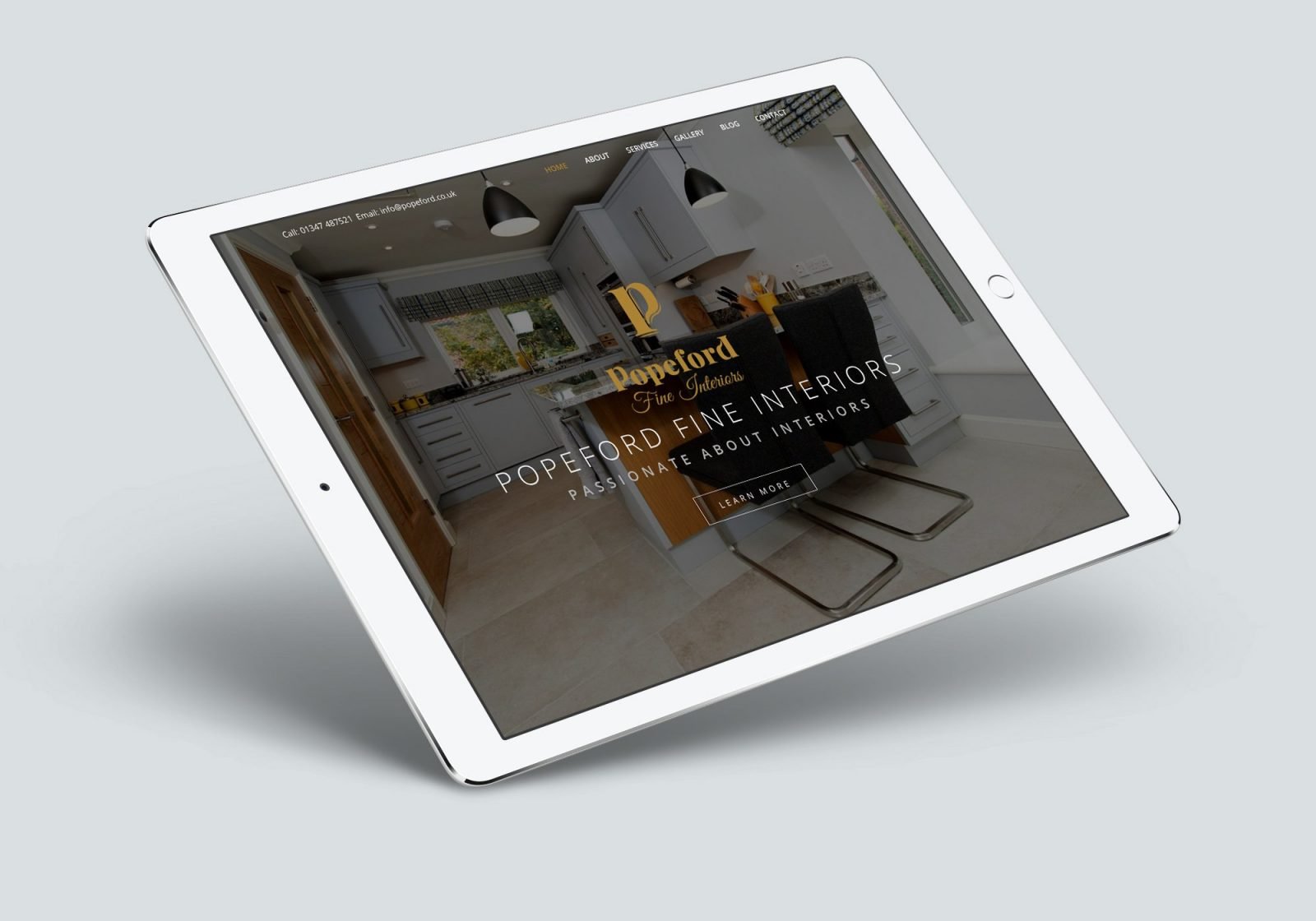 An ipad showing the home page for Popeford Interior Designers website design