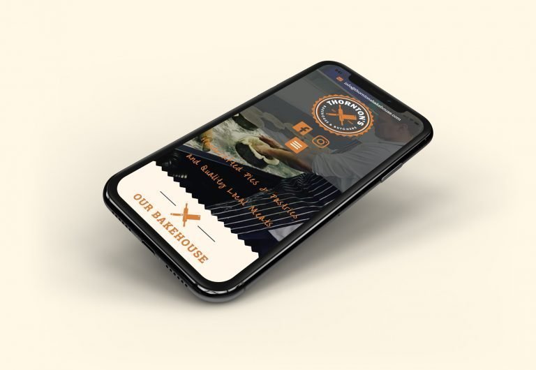 A phone showing the home page for Thornton's Butchers and Bakehouse website design